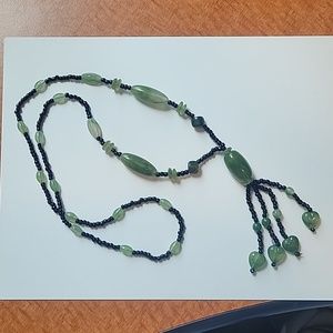 Green plastic and black glass bead necklace
